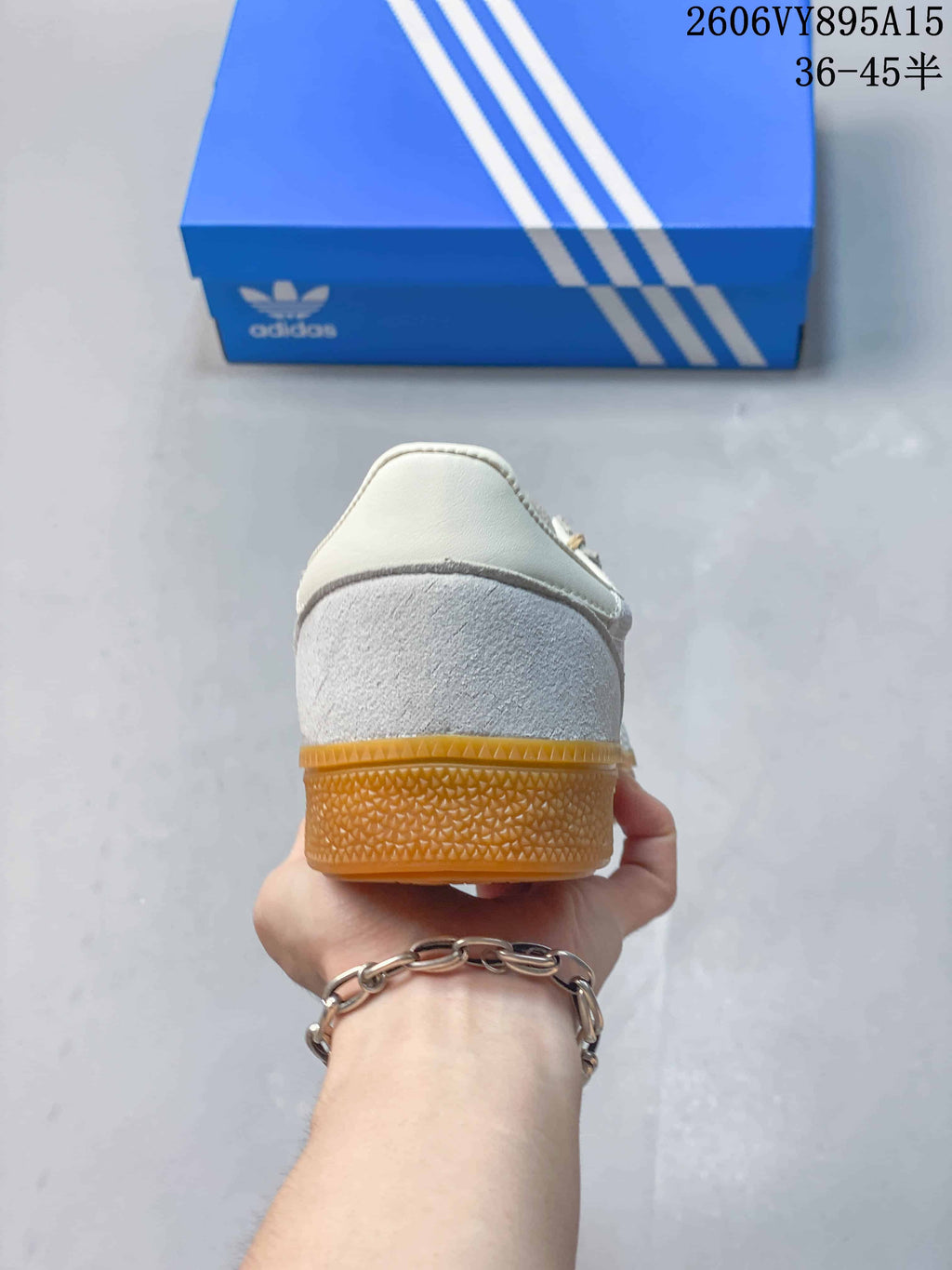 Rear view of the sneaker showing the heel and gum-colored sole