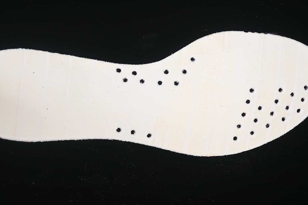 Close-up of the pale outsole with small black perforations