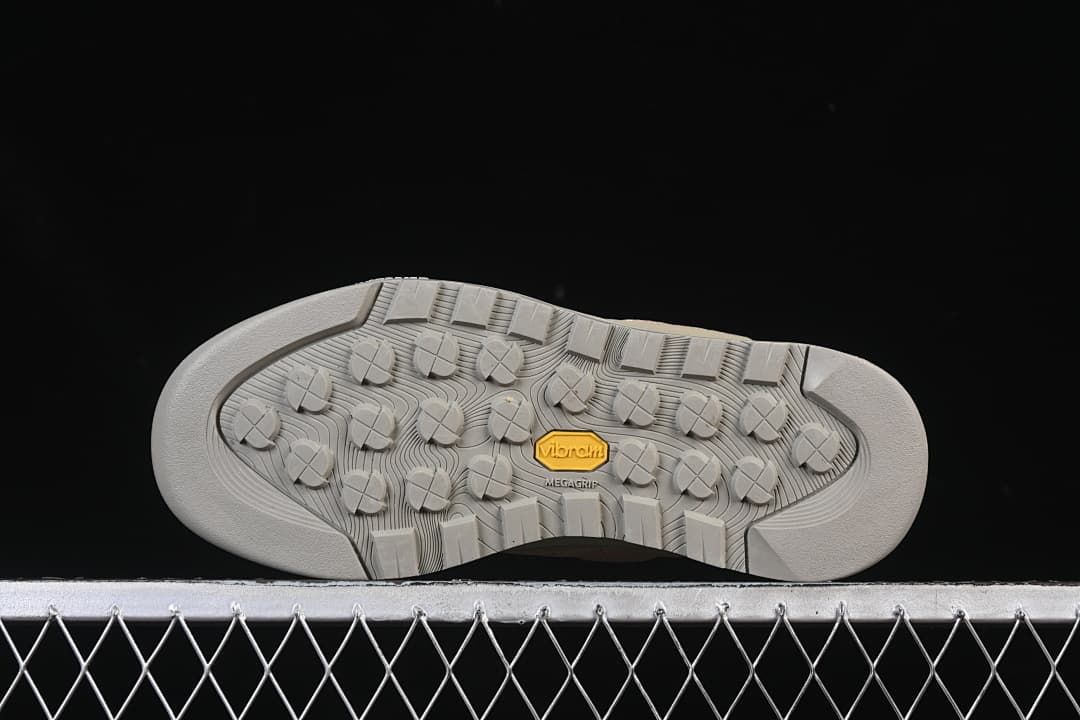 Underside of the outsole showing patterned tread and Vibram marking