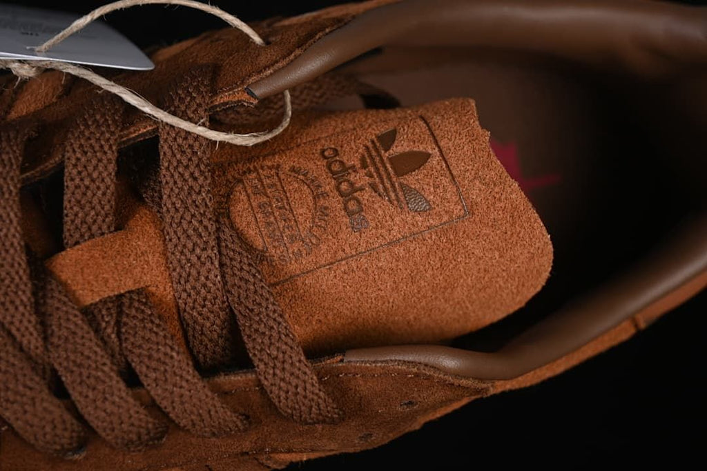 Close-up of the tongue branding and brown laces