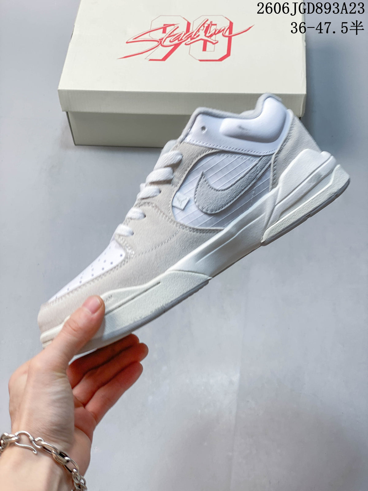 Side view of the white and light grey Jordan Stadium 90 sneaker