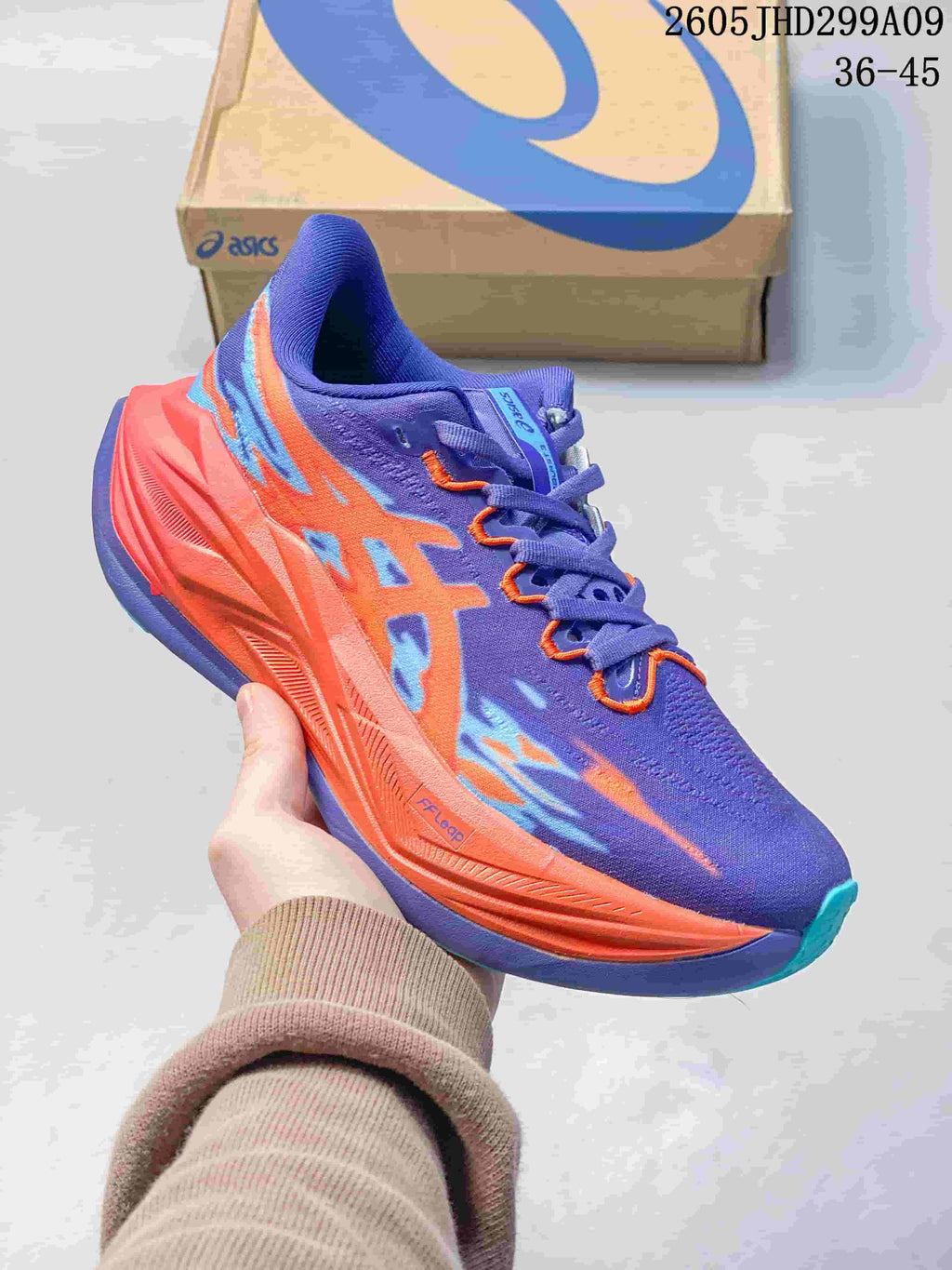 Purple and orange ASICS Superblast 3 running shoe
