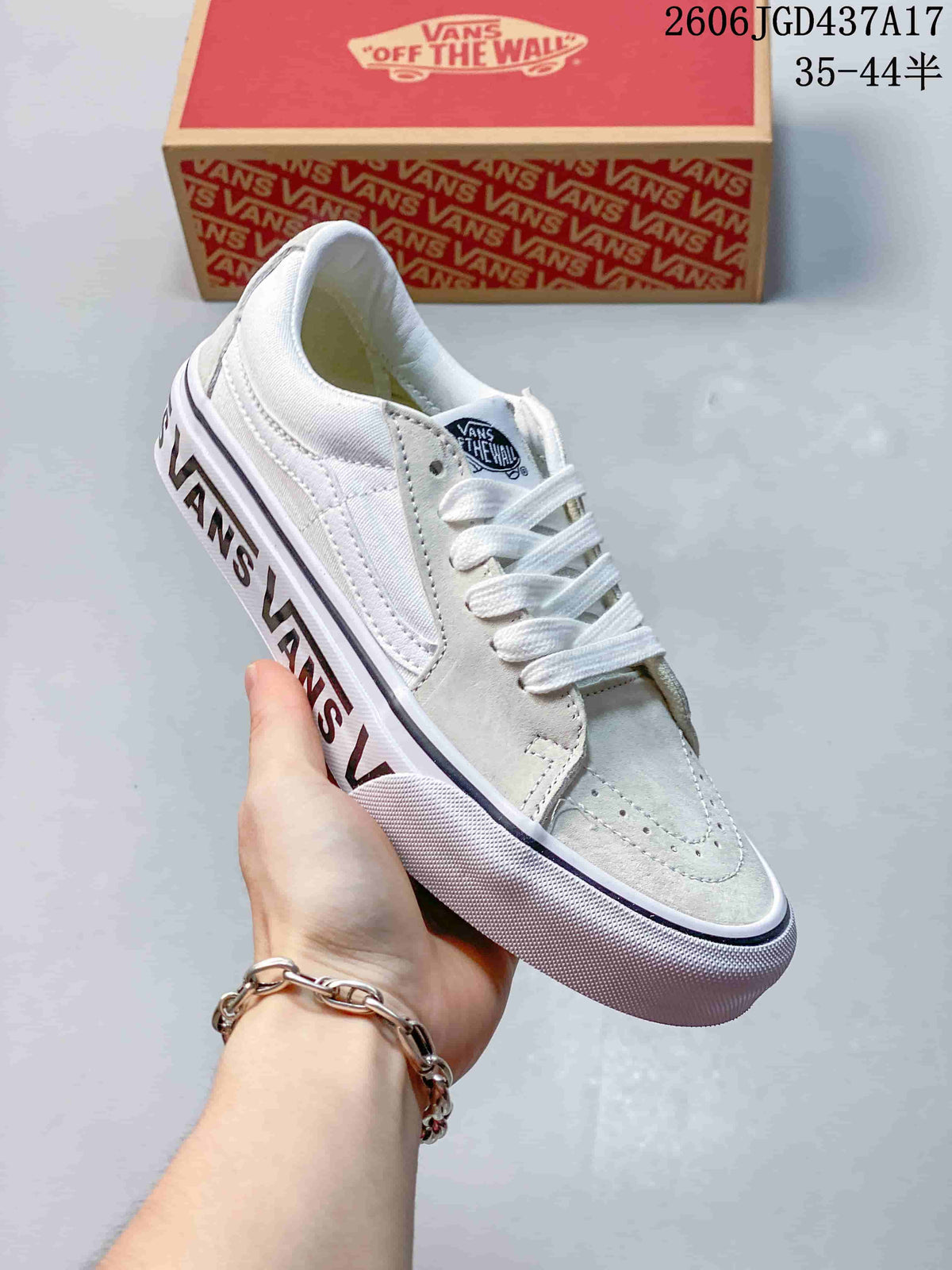 Angled view of the sneaker showing the lace-up upper, side stripe, and printed sole lettering.