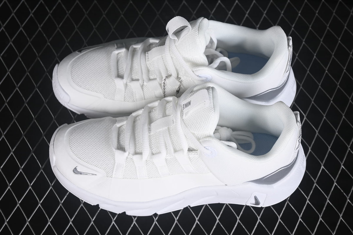 Angled top view of the pair showing the white mesh uppers, lace-up construction and padded openings.