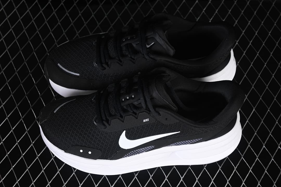 Pair of black and white Nike Comfort Ride Easyon shoes viewed from above.