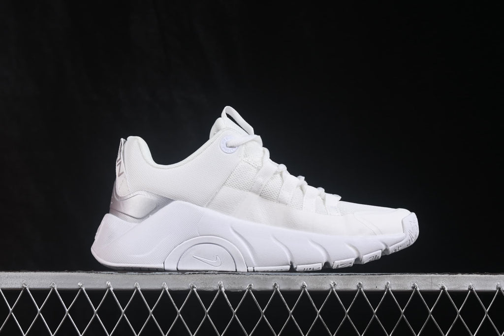 Side profile showing the white mesh upper, lace system and sculpted sole.