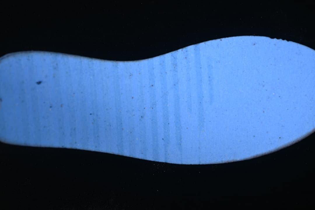 Close-up view of the sneaker's pale outsole.