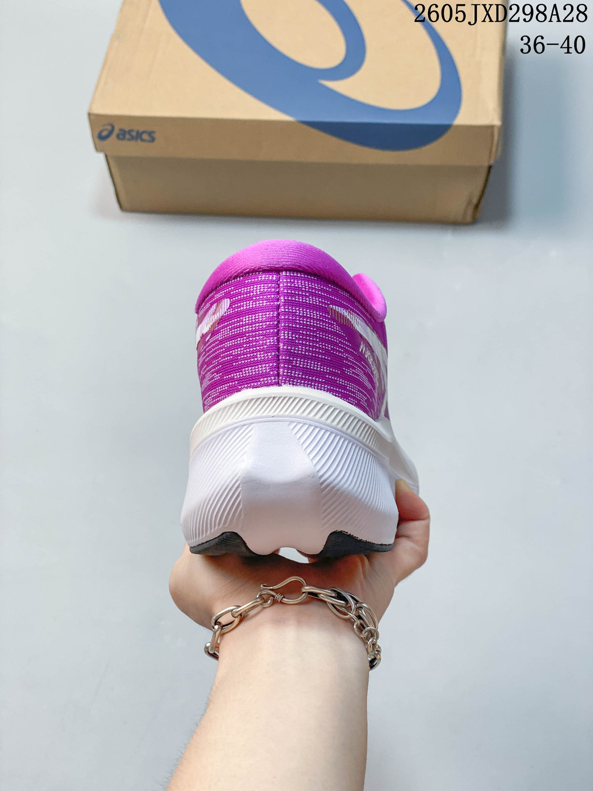 Rear view of the purple running shoe with a white midsole
