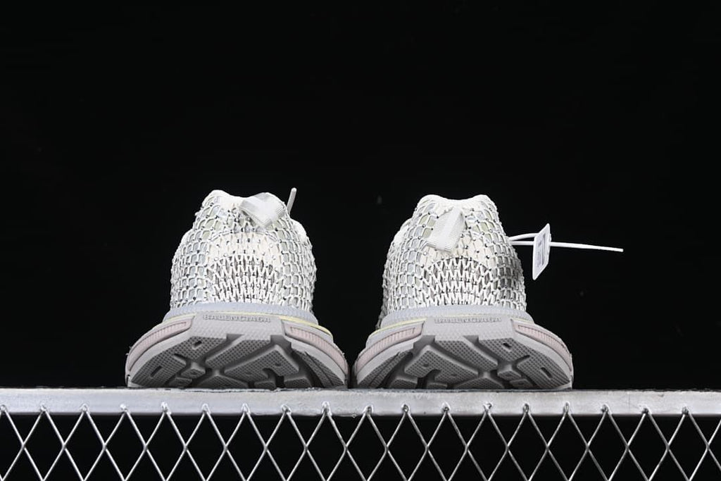 Rear view of the pair showing heel details and outsole