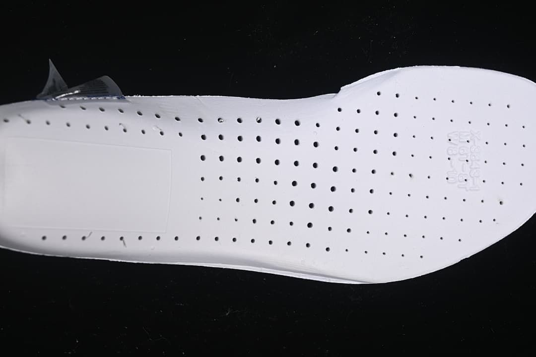 Close-up of the white shoe insole with perforations