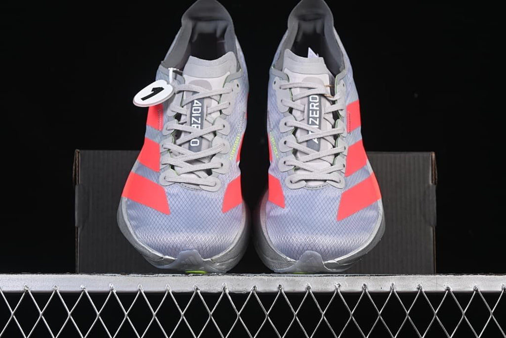 Front view of the pair showing gray uppers and coral stripes