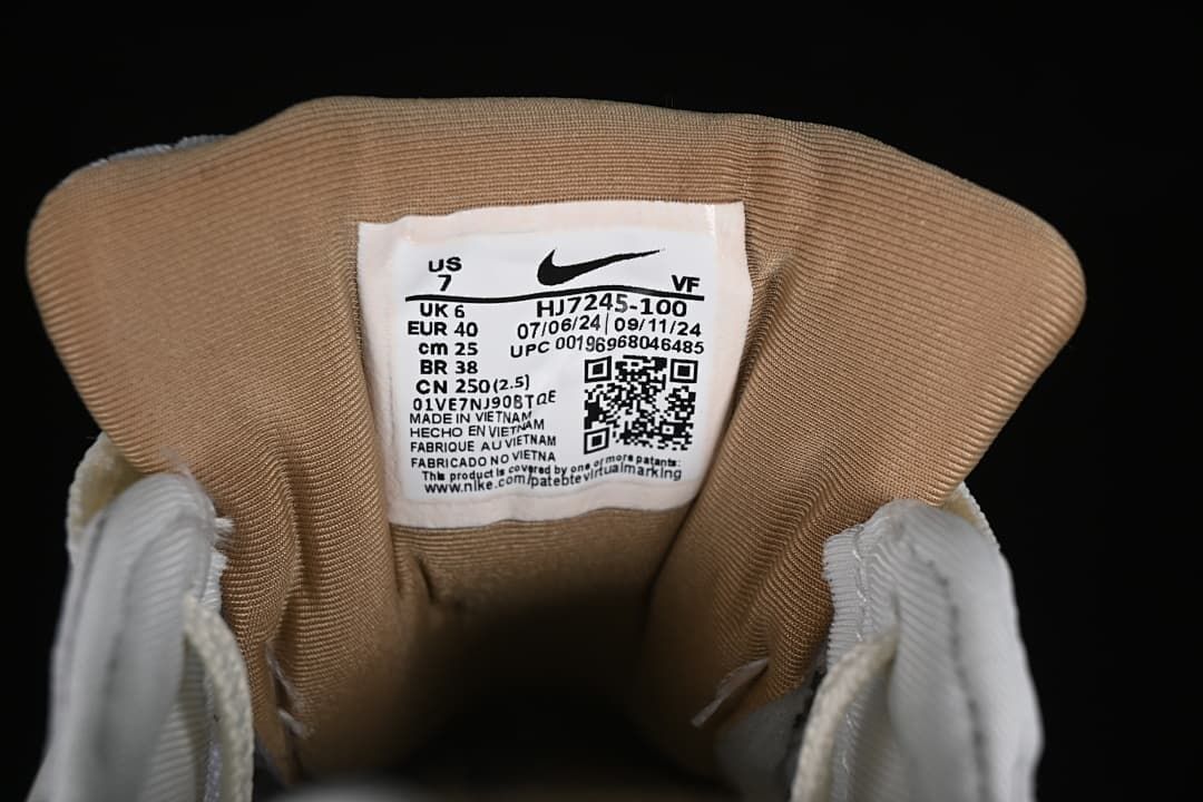 Inside shoe label showing HJ7245-100 and sample size information.