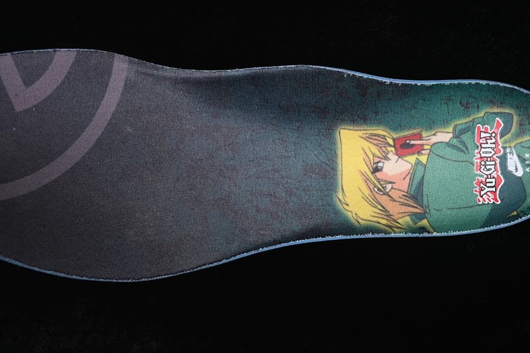 Printed graphic insole with an illustrated character