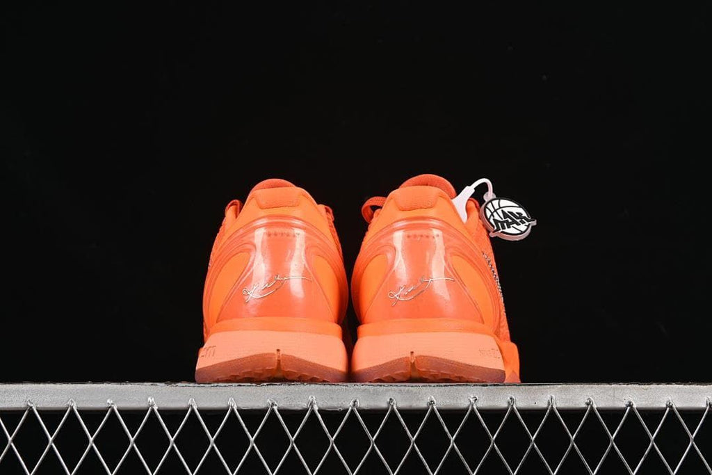Rear view of both orange shoes