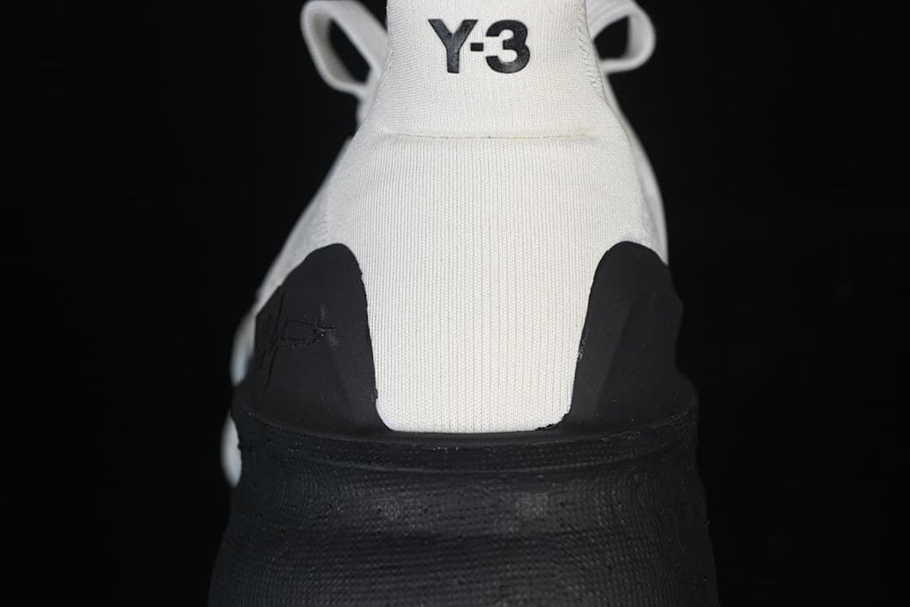 Rear view of the shoe with Y-3 heel branding and black heel panels