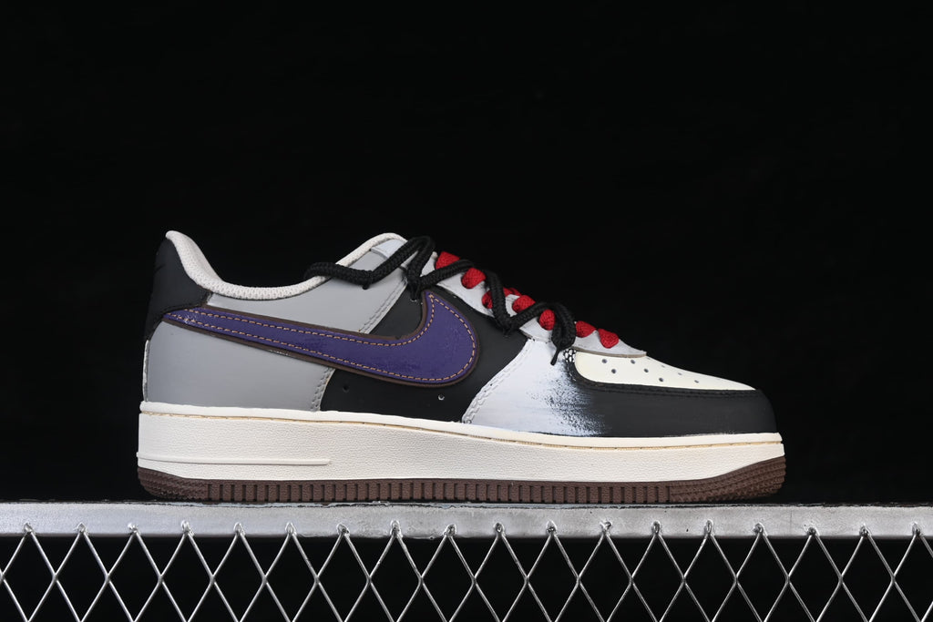 Outer side profile of the low-top sneaker with purple Swoosh and brown outsole