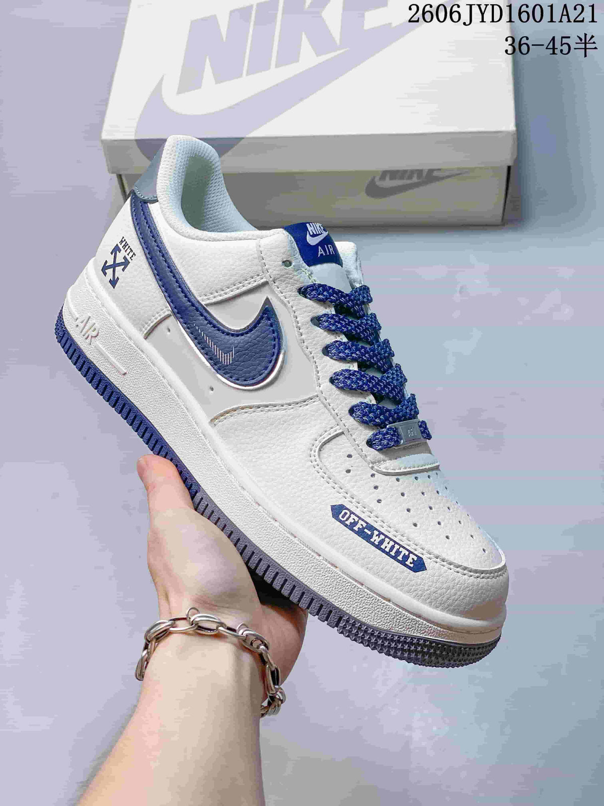 Angled side view of the white and blue sneaker with graphic details