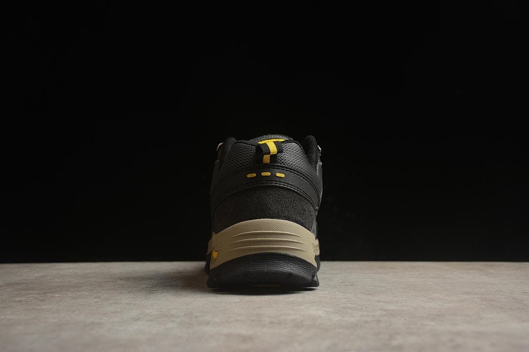 Rear view of the shoe showing the heel, pull tab and contrasting beige midsole.