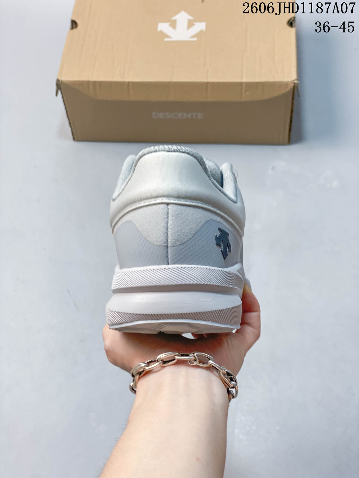 Rear view showing the heel and layered sole of a gray and white sneaker.