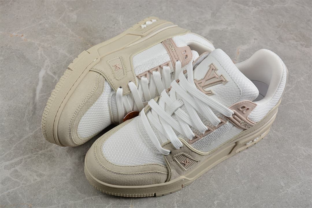Angled view of the pair showing the beige overlays, white panels, and sculpted soles.