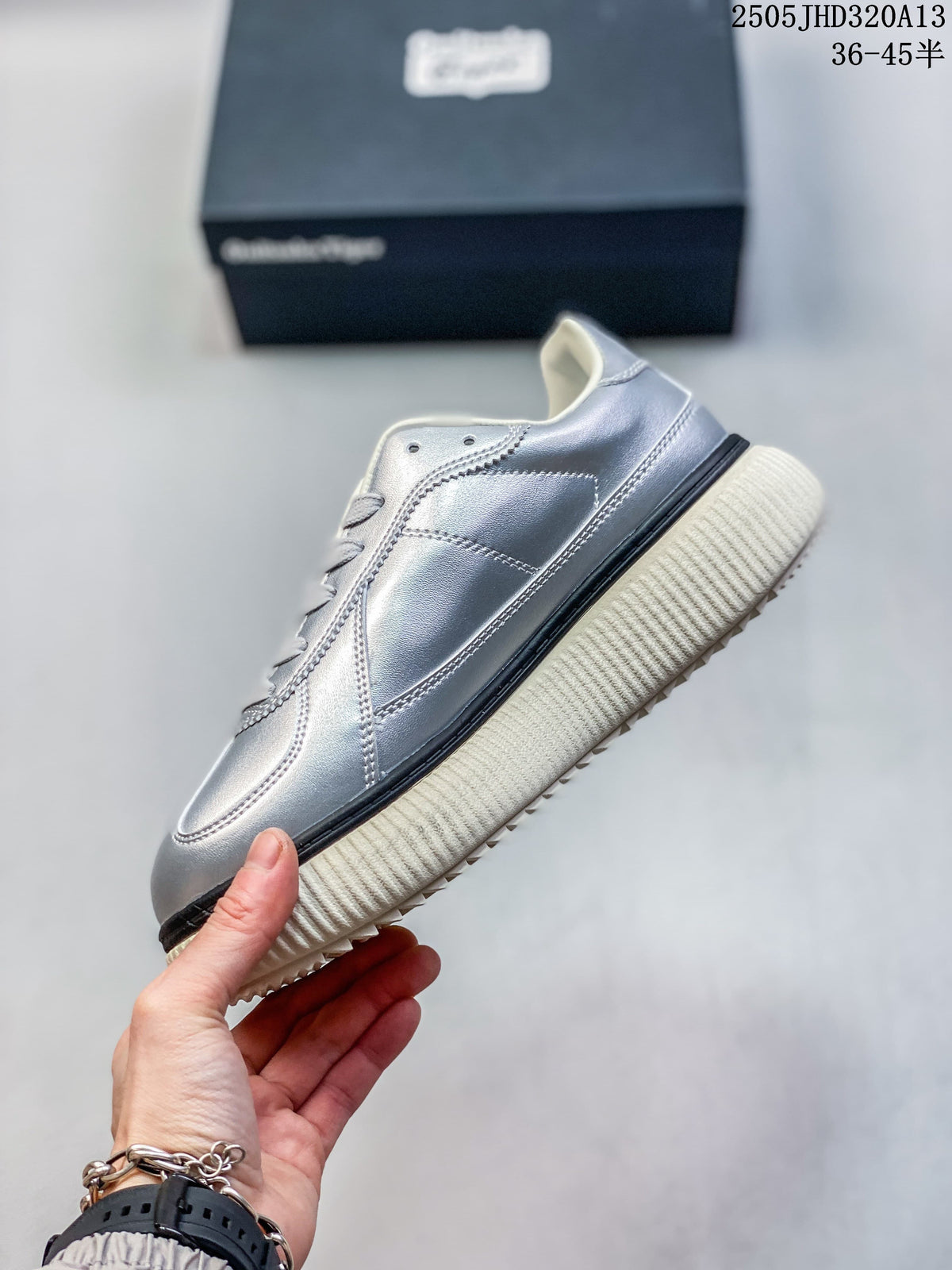 Side profile of the silver low-top sneaker with a ribbed platform-style sole