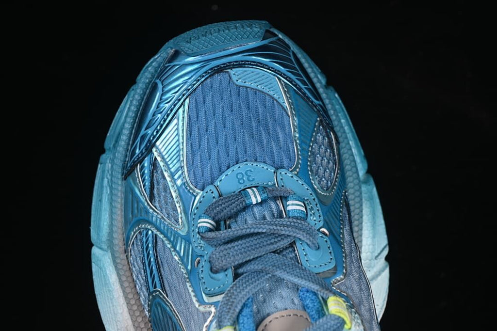 Top-down close-up of the sneaker toe and laces