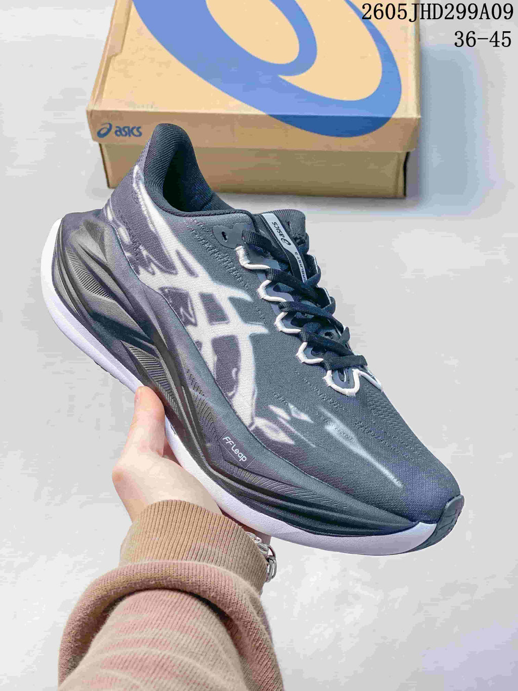 Dark gray ASICS Superblast 3 running shoe with contrasting graphics