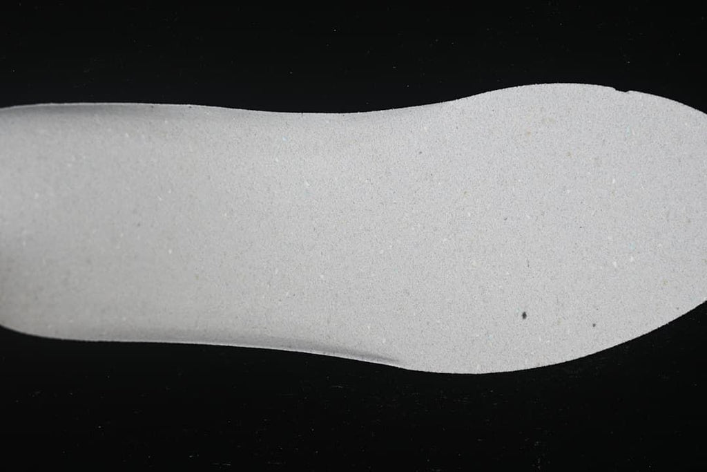 Close-up of the light-colored shoe midsole.