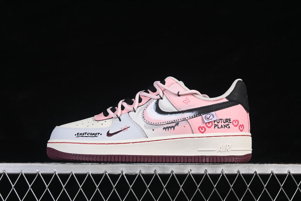 Side view showing pink and white panels and dark-colored outsole