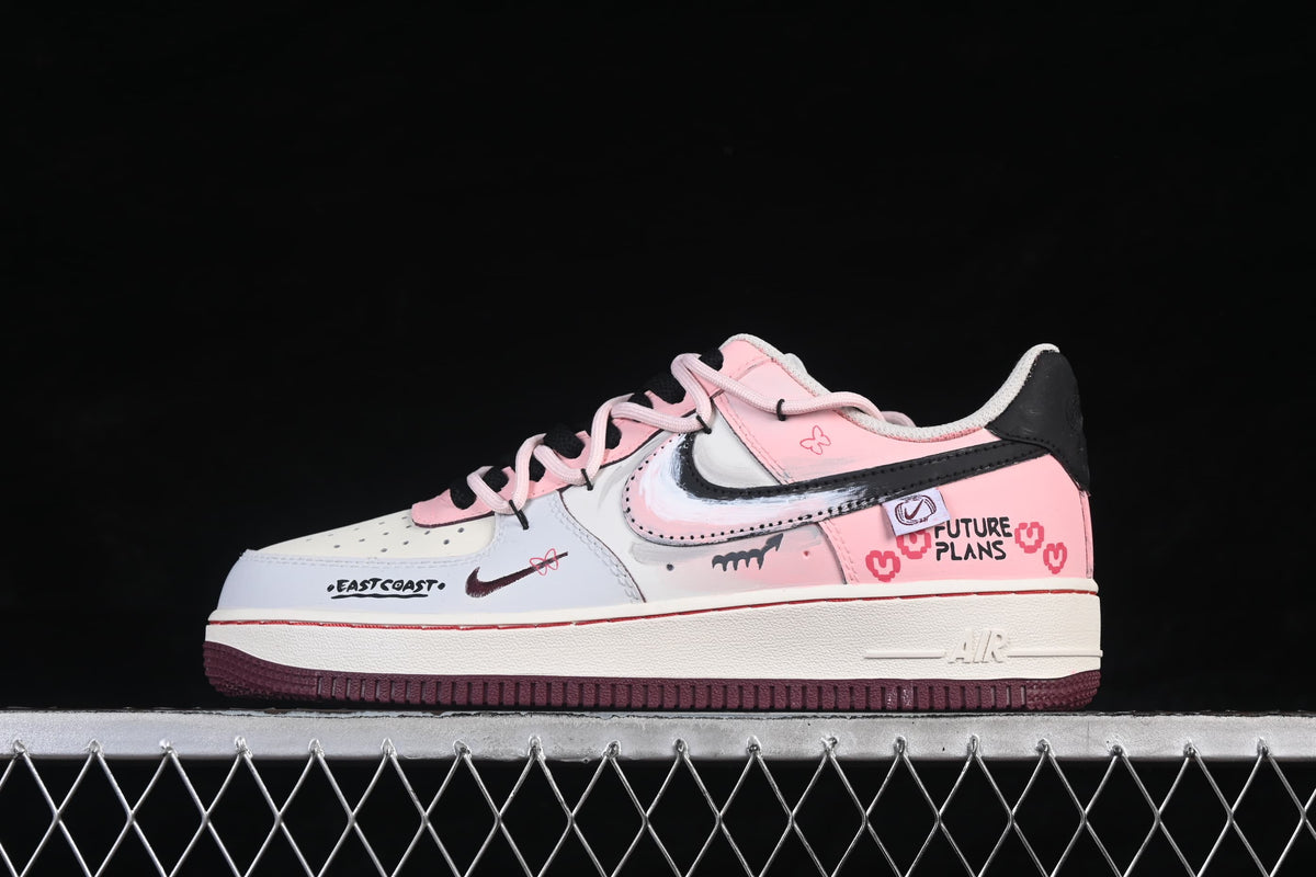 Side view showing pink and white panels and dark-colored outsole