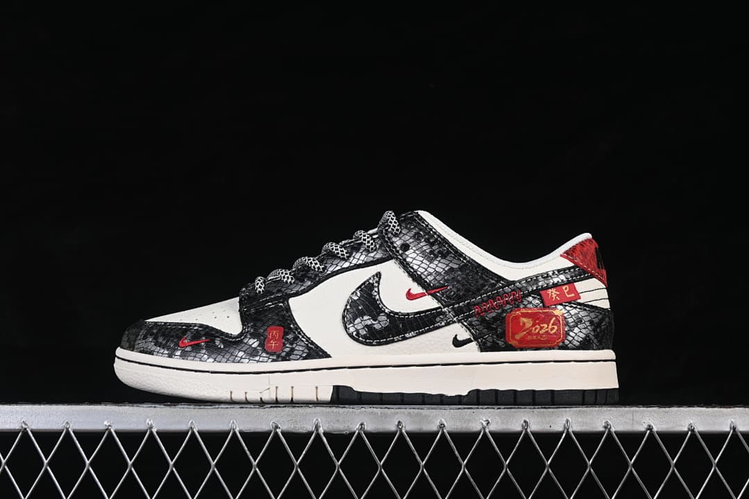 Side view of a black-and-white low-top sneaker with red accents and decorative Lunar New Year details.