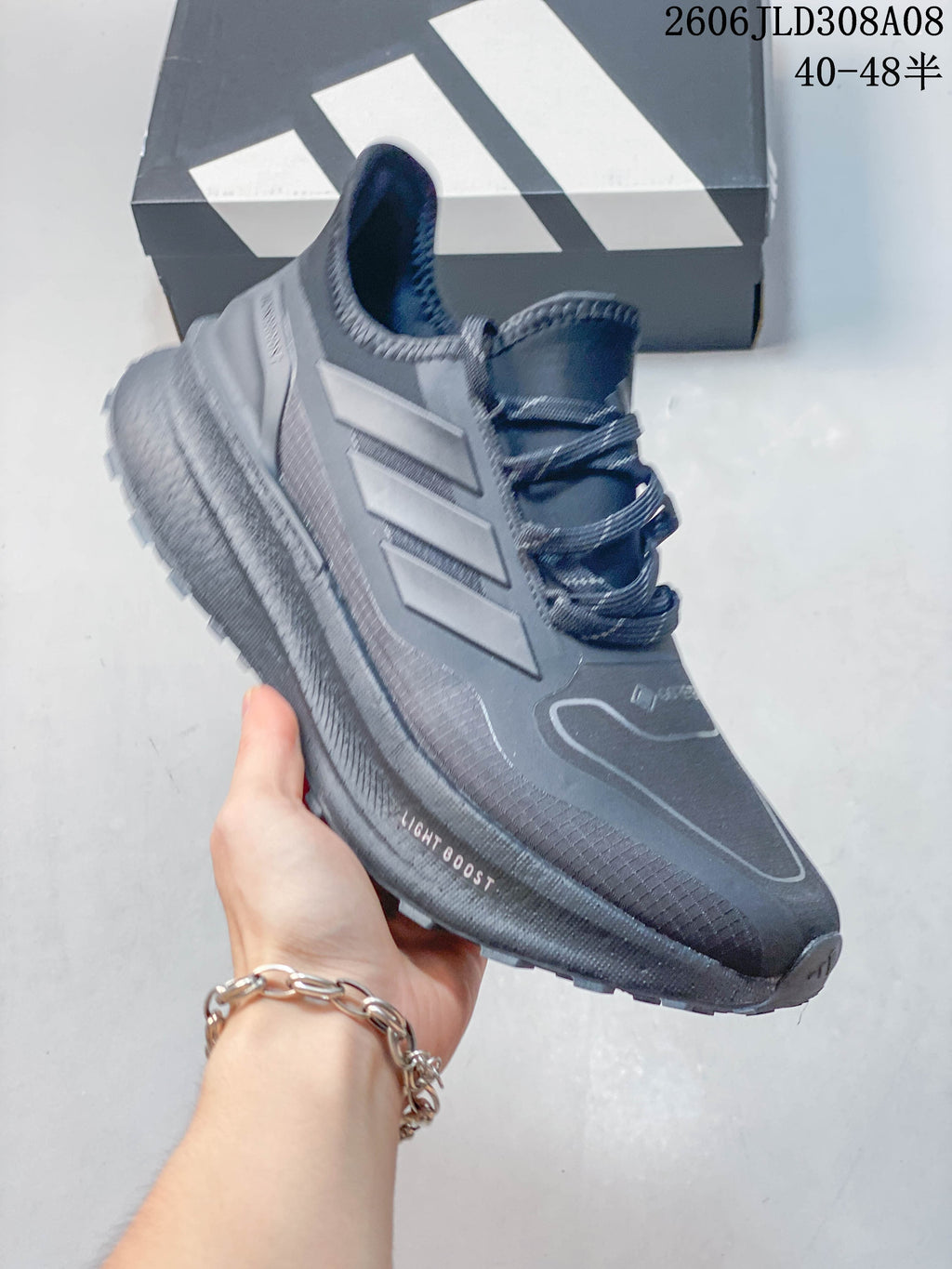 Angled side view showing the shoe's upper, three-stripe detail and midsole.
