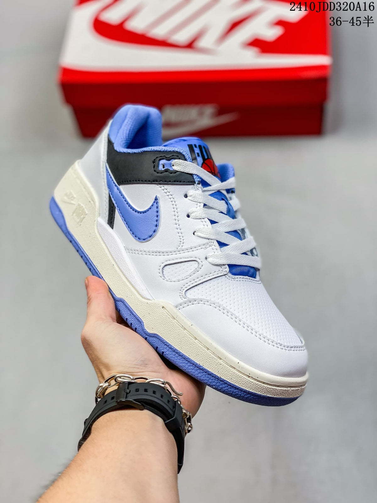 Angled side view of a white Nike Full Force Low sneaker with blue accents.
