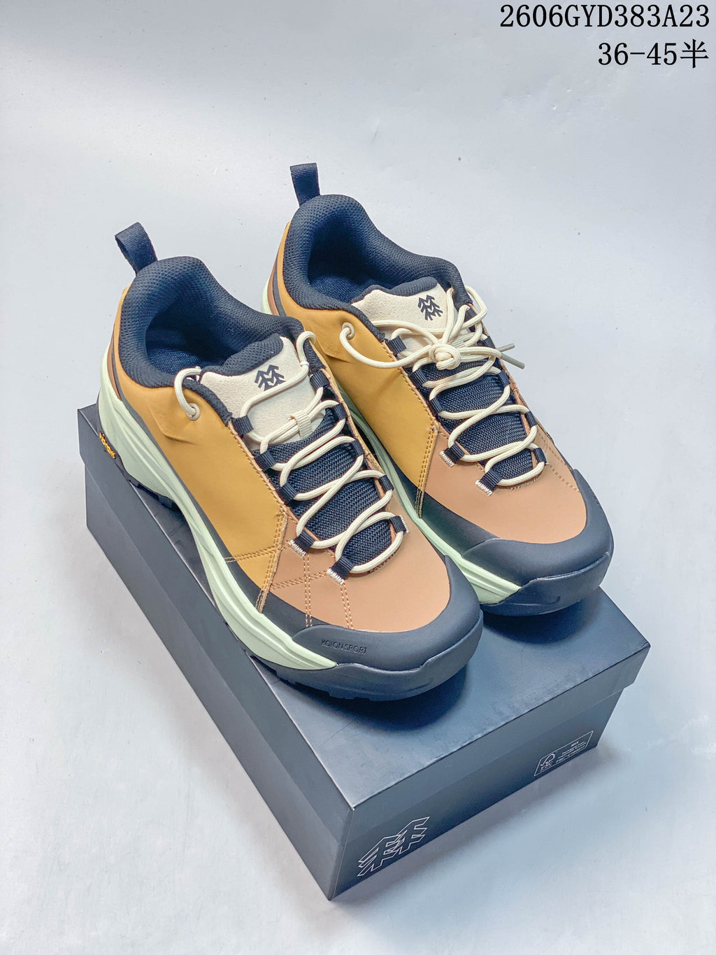 Pair of Kolon Sport low-top outdoor shoes in ochre, tan, navy, and pale green