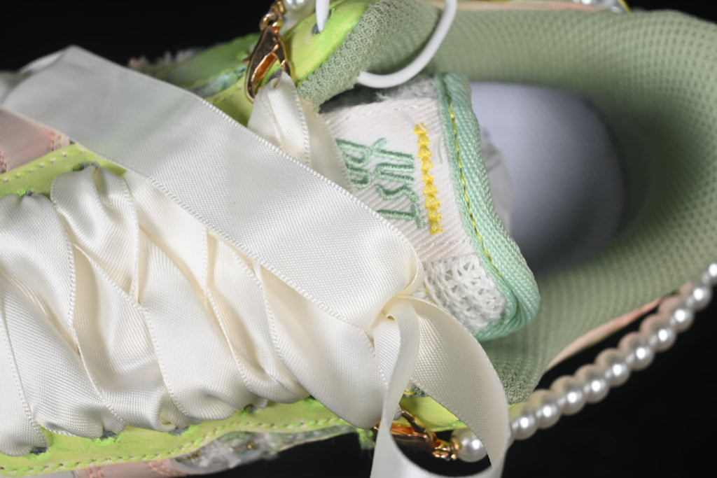 Close-up of ribbon-style laces and tongue detailing