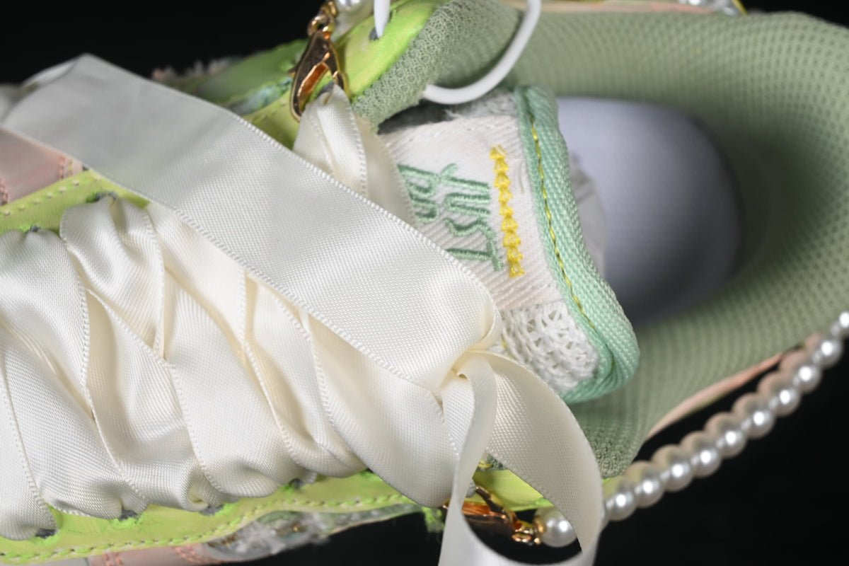 Close-up of ribbon-style laces and tongue detailing
