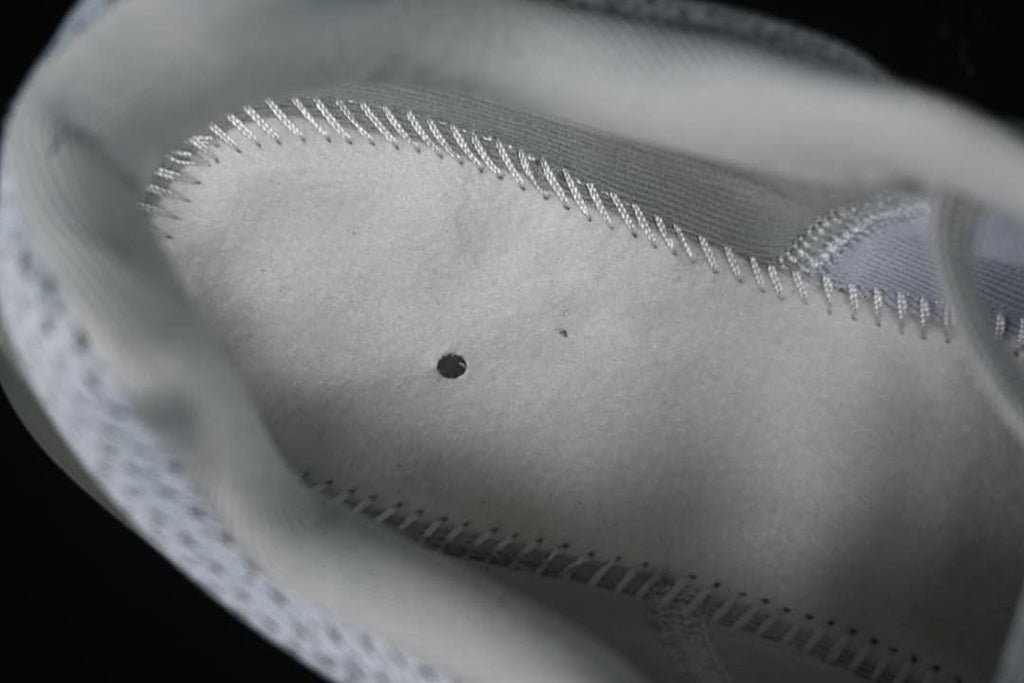 Close-up view inside the shoe showing lining and stitching