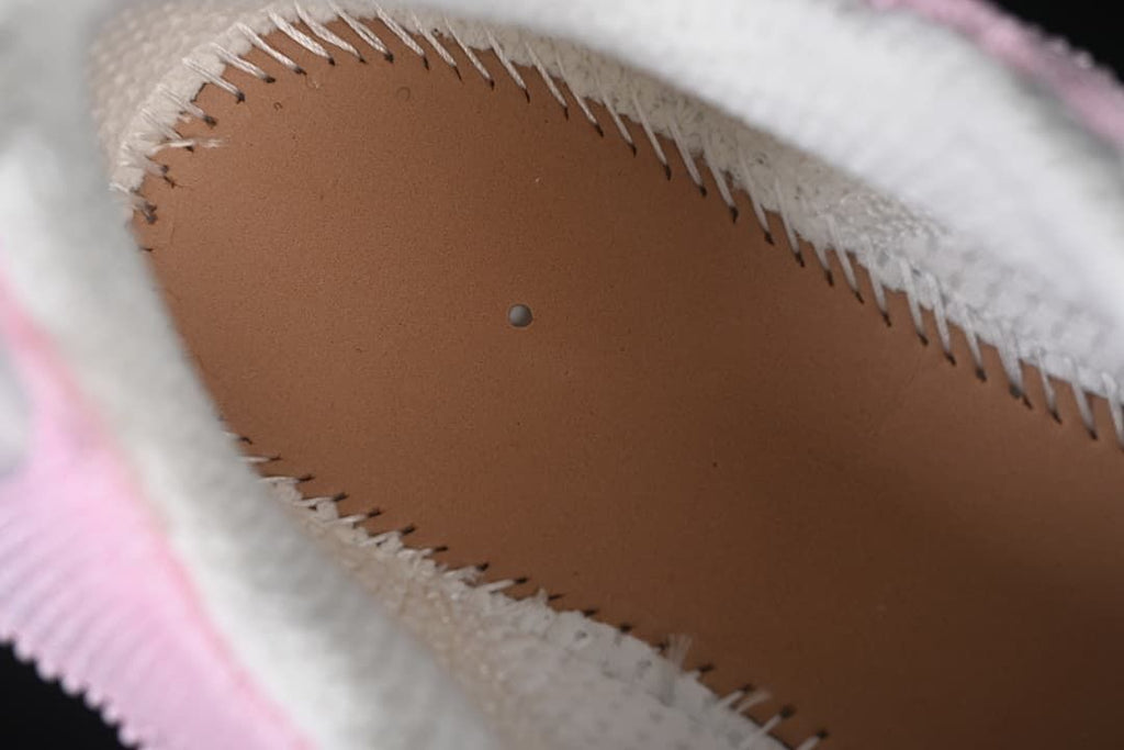 Interior view showing the stitched lining around the footbed.