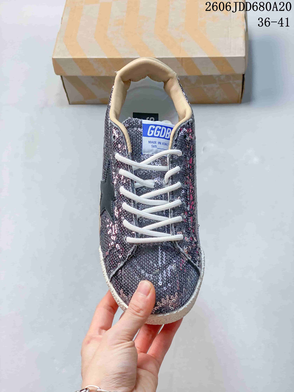 Front view of the sequin low-top sneaker with white laces