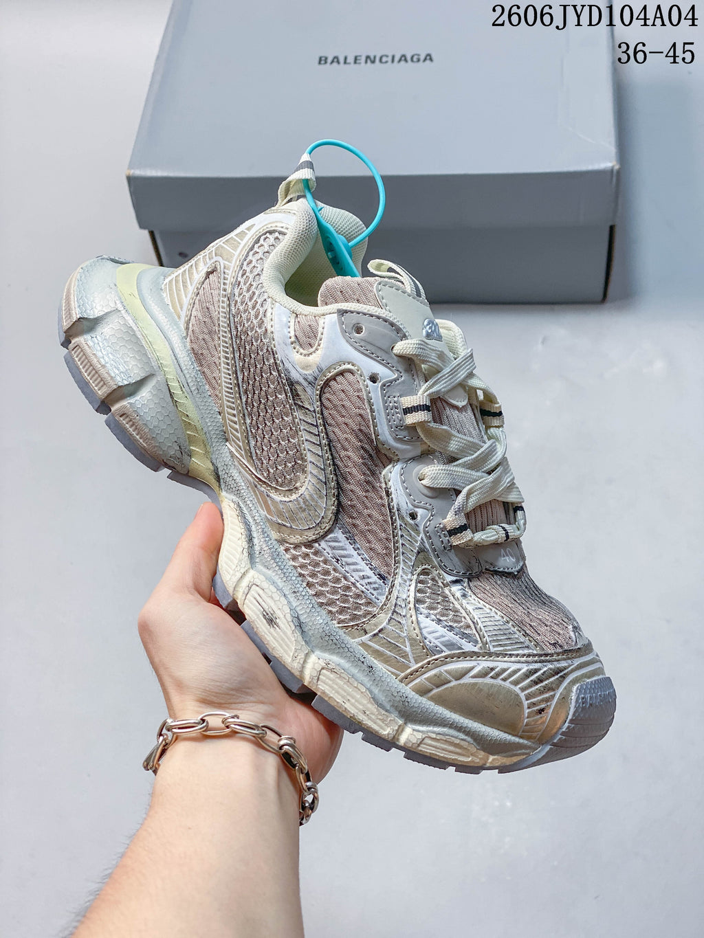 Angled side view of a chunky sneaker with a turquoise heel accent