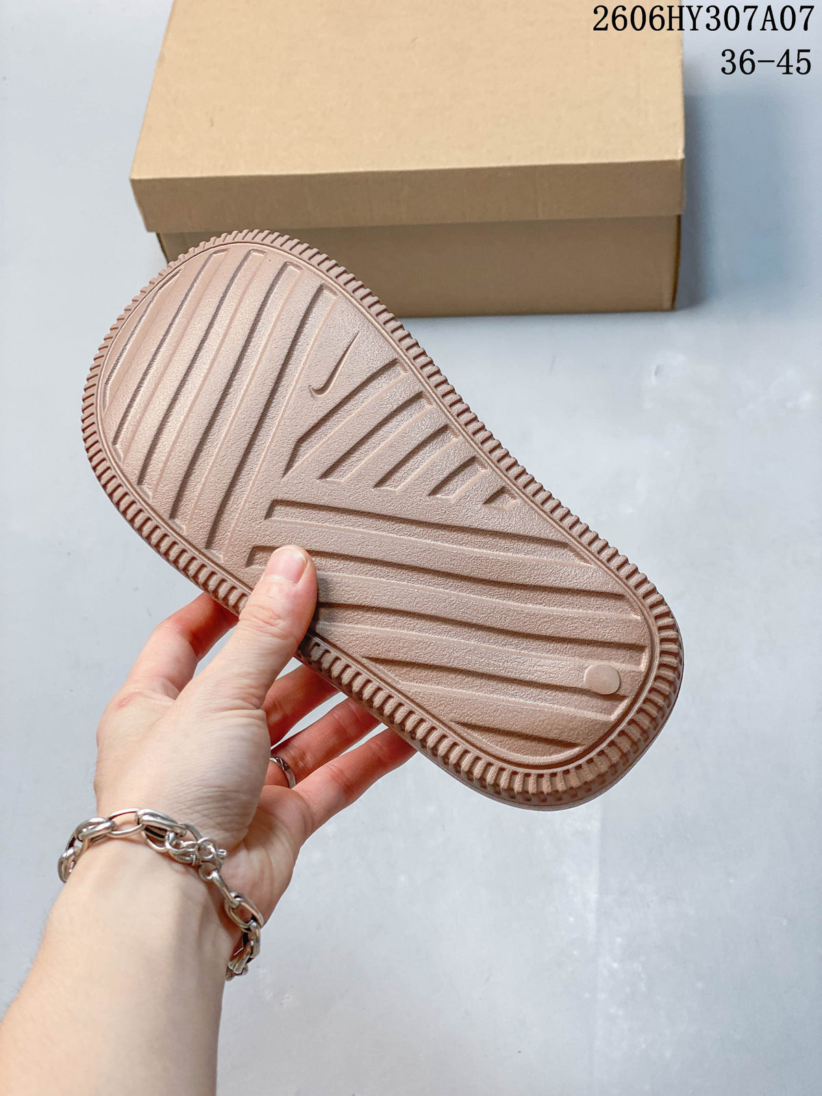 Underside of a taupe slide sandal showing its ridged outsole; image overlay shows sizes 36–45 and style code 2606HY307A07.