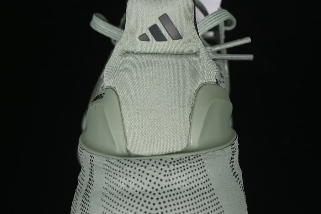 Rear view showing the heel tab, logo and patterned midsole