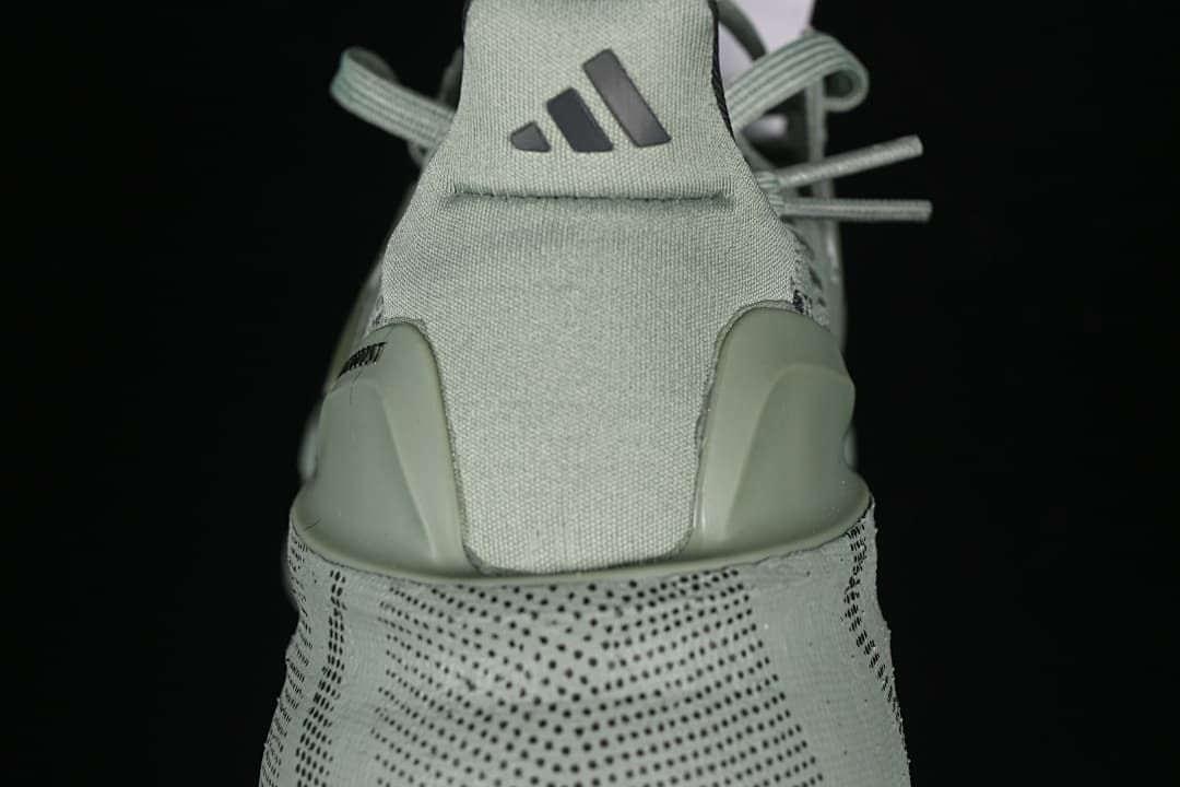 Rear view showing the heel tab, logo and patterned midsole