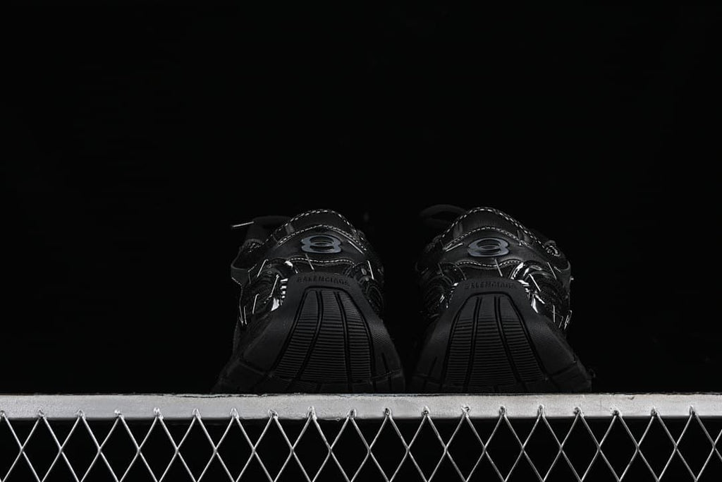 Rear view of the pair showing heel details and sole shape.