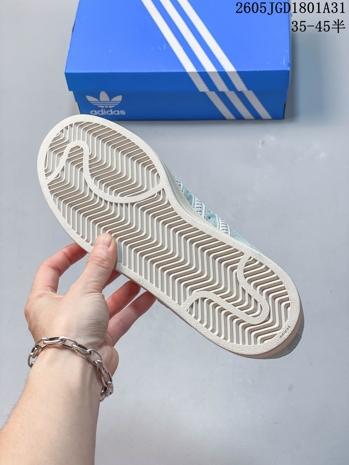 Close-up of the patterned outsole on a light blue Campus 00s sneaker
