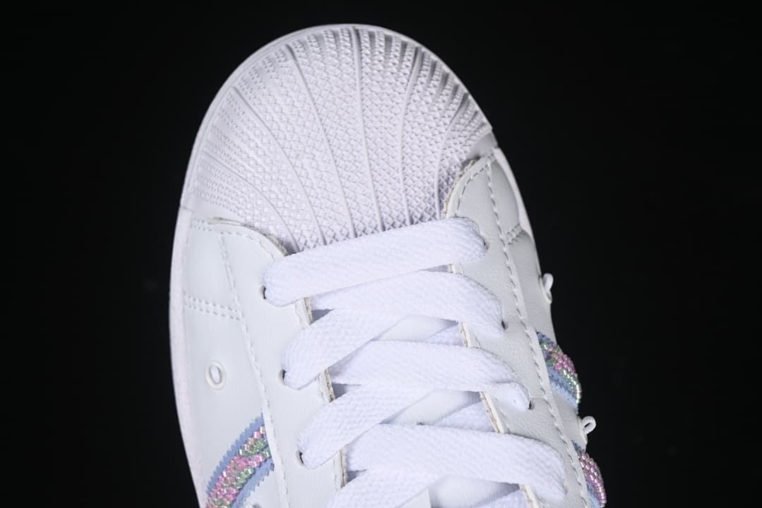 Top-down close-up of the shell-toe front and white laces