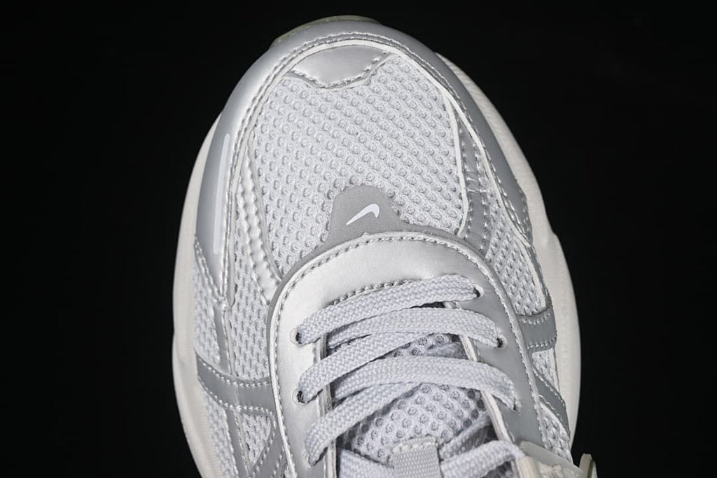 Top-down close-up of the sneaker toe and lace area