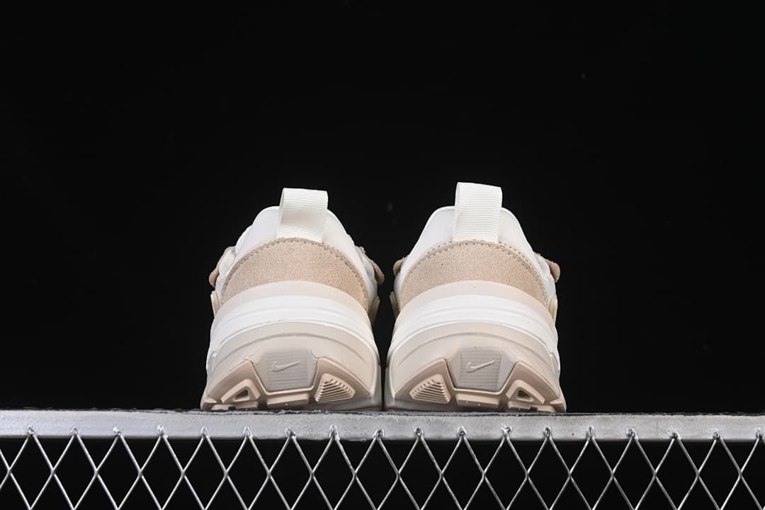 Rear view of both shoes showing heel panels and soles