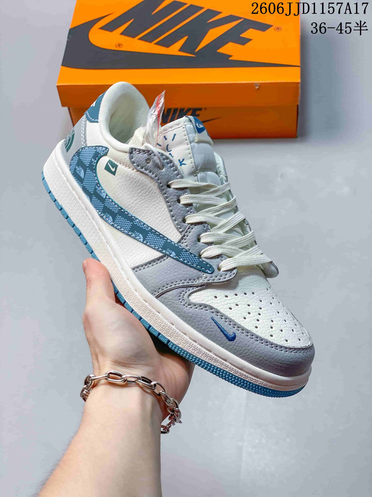 Angled side view of the sneaker, showing its blue patterned side detail and contrasting panels.