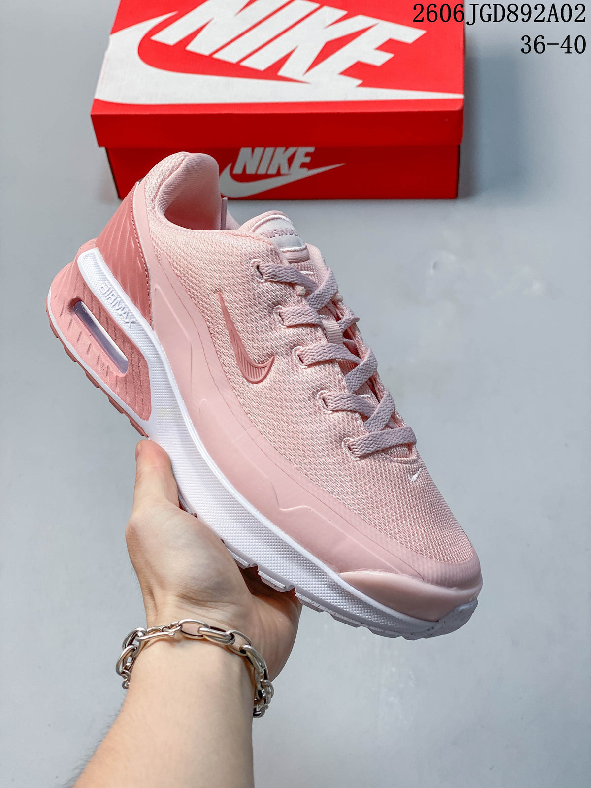 Angled side view of the pink Nike Air Max BIA shoe